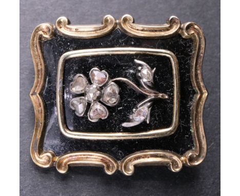 A 19th Century diamond and enamelled yellow metal mourning brooch, the front bearing a forget-me-not of eight rose-cut diamon