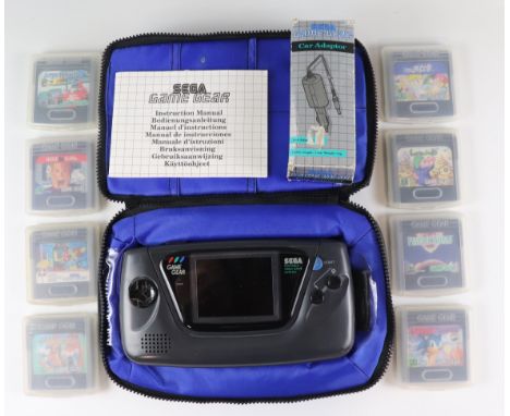 A SEGA Game Gear hand-held video game console, together with a case, charging wire, instructions, and a quantity of games inc