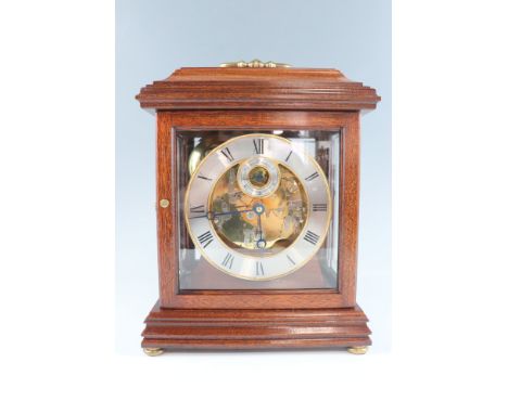 A late 20th Century mahogany bracket clock, the Hermle movement striking and chiming on four bells and having a platform esca