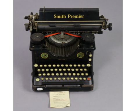 A vintage Smith Premier typewriter with cover; a gent’s walking cane; a vintage petrol can, etc. 