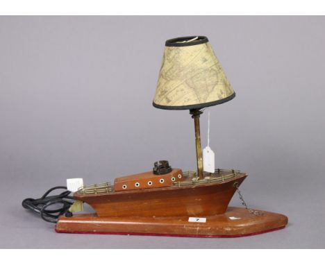A wooden novelty table lamp base in the form of a boat, 17” wide, with shade. 