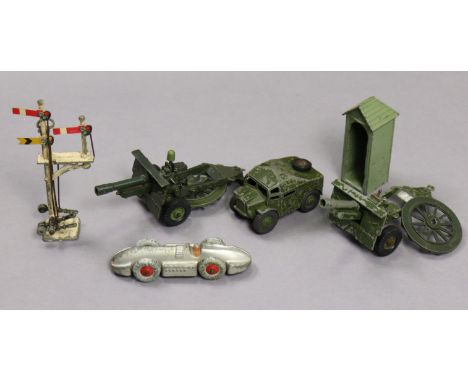 A Dinky die-cast model “Speed of The Wind” racing car (No. 23E); a Britains scale model sentry box; three various military mo