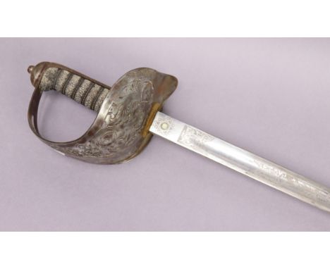 A George V calvary officers dress sword, with an etched blade, pierced guard, and with a leather scabbard.