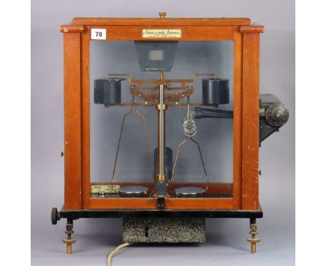 A vintage “Release O-Matic” laboratory balance by L. Oertling of London, in a mahogany case.