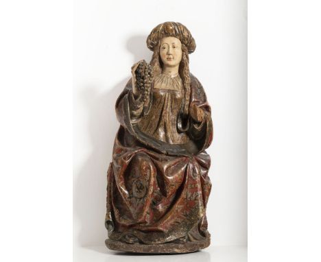 Statue of painted and gilded wood. Part of the figure is carved on the back. The Madonna is designed in the Gothic style, sea