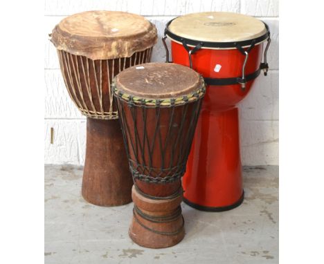 Three African Djembe drums, to include a Stagg example, height of tallest 63cm (3).