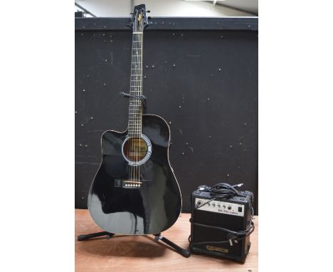 A Stagg electric/acoustic guitar with stand and an Elevation practice amplifier (3).