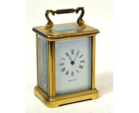 A brass Mappin & Webb Ltd carriage clock, the dial set with Roman numerals, height 14cm.