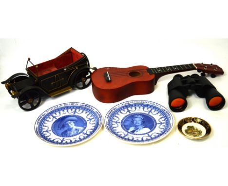 A collectors' lot comprising ukulele in soft shell case, a 20th century metal musical car, a cased pair of 10 x 50 field bino
