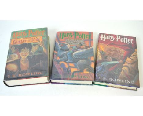 Three Harry Potter American first edition books; 'Harry Potter and the Chamber of Secrets', 'Harry Potter and the Prisoner of