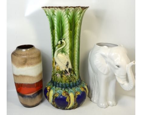 A decorative white glazed ceramic elephant, height 45cm, a larger jardinière stand, height 70cm and a West German vase, heigh