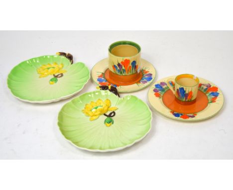 Two Clarice Cliff 'Bizarre' pattern plates, mug and small jar (all af) and two Carlton Ware 'Australian' design plates (6).