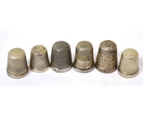 Six various hallmarked silver thimbles, all Birmingham and various dates, approx 0.6ozt, also a silver plated thimble (7).