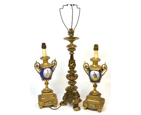 A pair of reproduction gilt metal and blue ground ceramic urn shaped table lamps, height of both 44cm and a larger brass tabl