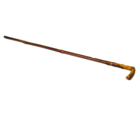 A late 19th century sword stick with angled horn handle and push button release and bamboo scabbard, length 87cm.