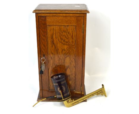 A small single door oak cabinet, height 53cm and a sanctuary light, both pieces were previously in St Francis Church in Skelm
