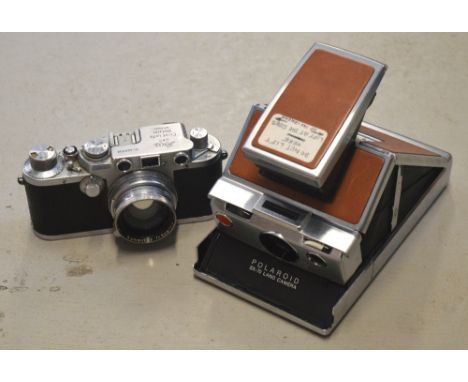A Leica IIIC leather cased camera, serial number 468800 indicating year of manufacture for 1949, also a leather cased Polaroi