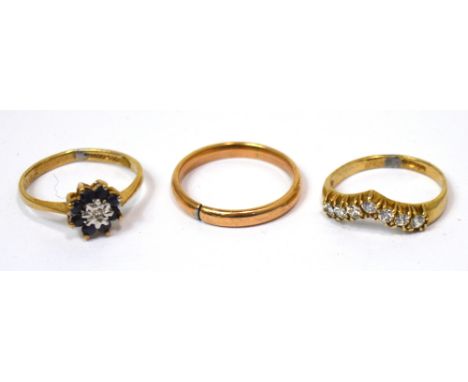Two 9ct yellow gold dress rings, one set with a row of eight white stones, size K and a yellow metal wedding band, size M, ap