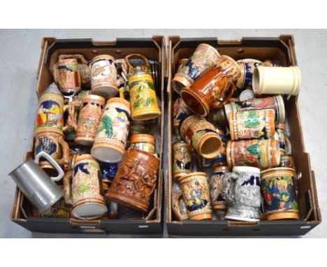 A quantity of ceramic and pewter steins.