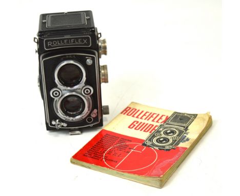 A leather cased Rolleiflex Rollei Franke & Heidecke Braunschweig DBP DBGM camera, serial no.1416584, with Rolleiflex guide bo