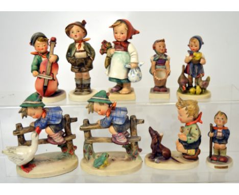 Nine various Hummel/Goebel figures, the largest examples modelled as a young boy on a fence being harassed by a goose and a s