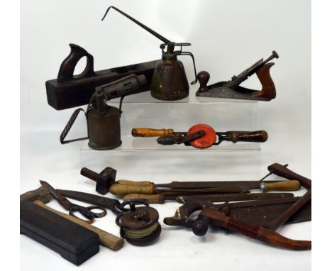 A quantity of vintage tools to include planes, saws etc.