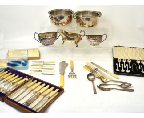 A quantity of silver plated items to include a sauce boat, a matching twin handled basin and milk jug, two twin handled bowls