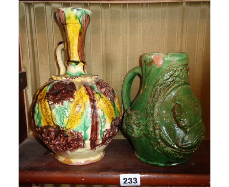 Ottoman Chanakkale polychrome pottery ewer, 27cms and an unusual later green glazed similar with portrait mask of Ataturk