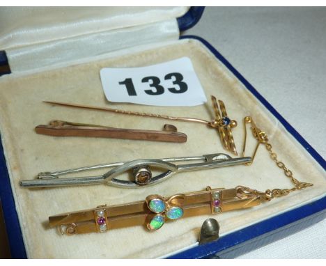 Two 9ct gold bar brooches, one set with opals and seed pearls, antique white metal bar brooch and a 9ct gold stick-pin