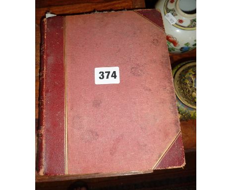 Victorian album of embossed paper coats of arms and crests cut from envelopes including Queen Victoria, Napoleon lll, his son