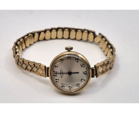 A Rotary 9ct. gold ladies' wrist watch, having signed silvered circular Arabic numeral dial, to gold plated expanding bracele
