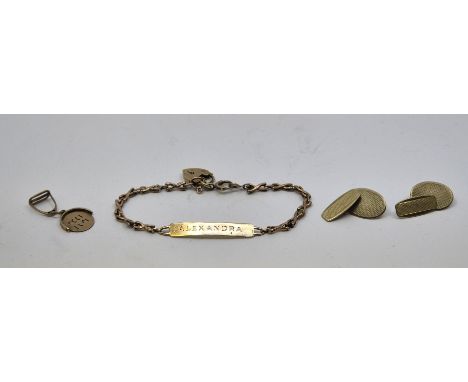 A pair of 9ct. gold engine turned cufflinks, chain fitting, together with a 9ct. gold identity bracelet and a 9ct. gold charm