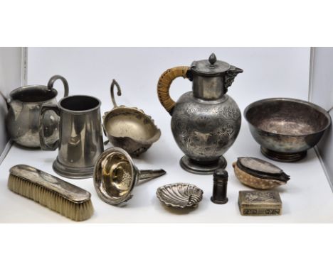 A mid 19th century Britannia metal lidded jug, engraved to hinged cover and side, with cast mask spout and woven rattan cover