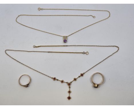 A 9ct. gold and ruby pendant necklace, the Belcher link chain with four quatrefoil and bar links to centre, each set single r