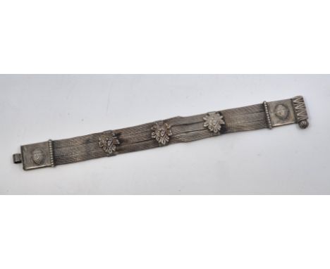 An Middle Eastern white metal bracelet, woven with box clasp (white metal assessed as silver), length 19cm. (39.8g)