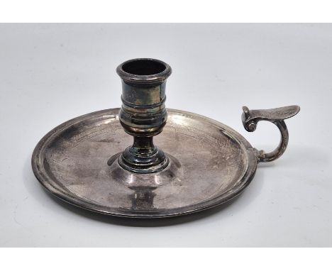 A George II silver chamberstick, by David Willaume II, London 1733, of typical circular form with 'C' form handle, engraved t
