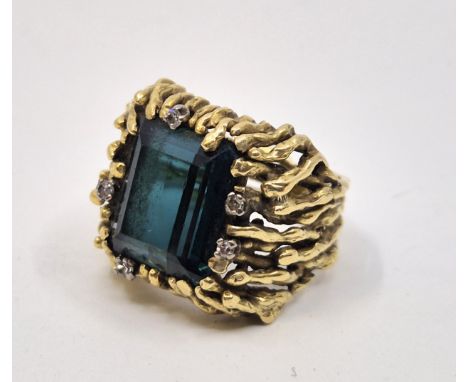 A 18ct. gold, diamond and greenish-blue tourmaline (Indicolite) ring,&nbsp;having rectangular step cut indicolite to centre i