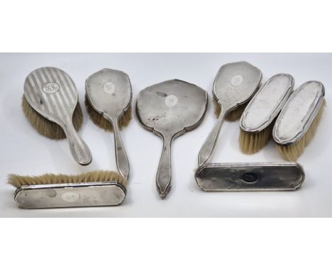 A five piece engine turned silver mounted dressing set, by Barker Brothers Silver Ltd, Birmingham 1935-36, comprising hand mi