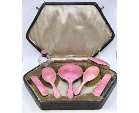 A silver and pink guilloche enamel dressing table set, by Henry Clifford &amp; Davis, Birmingham 1918-29, comprising hand mir