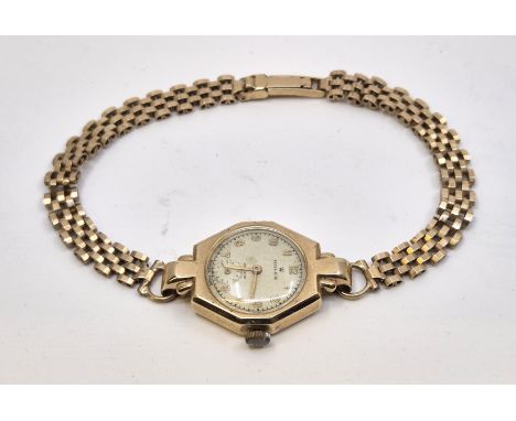 A 9ct. gold Rolex ladies' wrist watch, manual movement, having signed circular dial with applied gold Arabic numerals and out