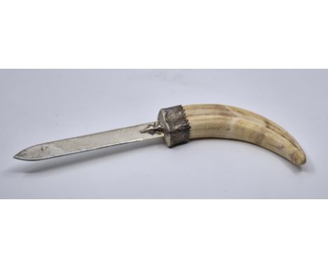 A silver bladed wild boars tusk handled letter opener,&nbsp;by EE &amp; TH, London 1990, engraved "Zambezi 1989", length 27.7