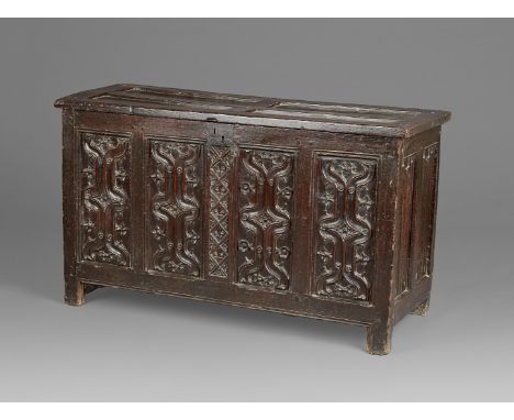 A FINE AND EXTREMELY RARE ENGLISH HENRY VIII OAK PARCHEMIN-CARVED COFFER. CIRCA 1530. The hinged lid with four quadrant panel
