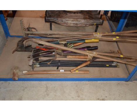 A quantity of long handled gardening tools 