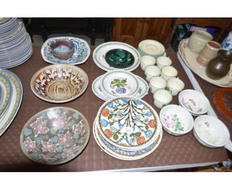 A quantity of Studio pottery bowls and plates; Portmeirion plates; Poole pottery teaware etc.