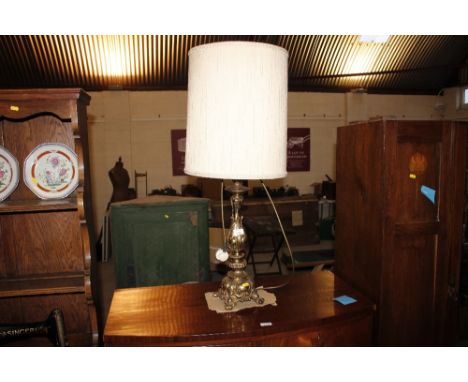 A gilt metal lamp and shade