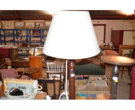 A large mahogany standard lamp and shade 