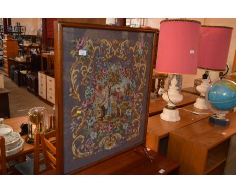 A 19th Century needlework firescreen