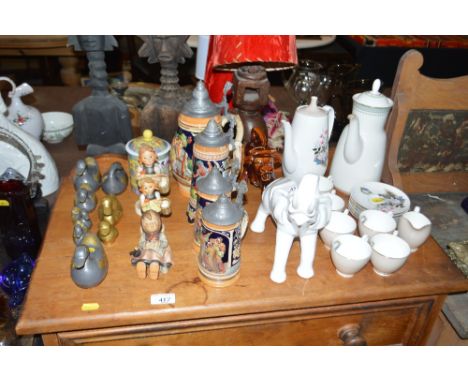 Four continental steins; three Goebel figures; a white glazed elephant ornament; a quantity of Adderley floral decorated coff