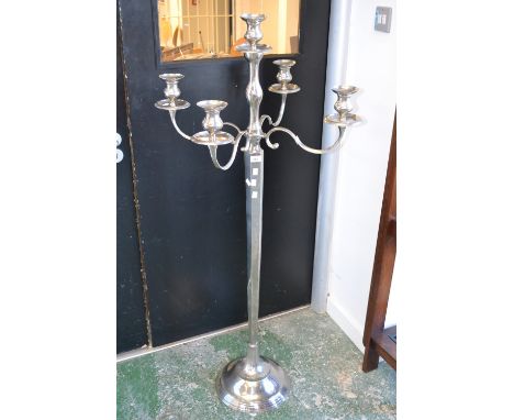 A modern floor standing four branch five light candelabra 