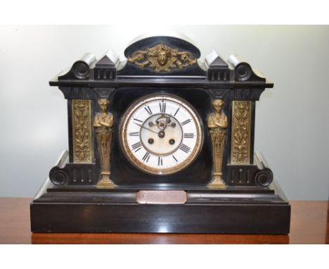 An Edwardian Ashford slate and brass mantel clock, architectural case, classical mask and columns, presentation plaque to P C